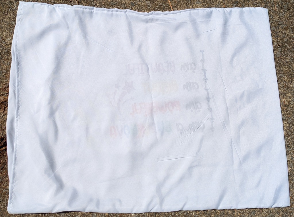 Image shows the back of the pillowcase showing how the image bled through to the back where there was no butcher paper in between.