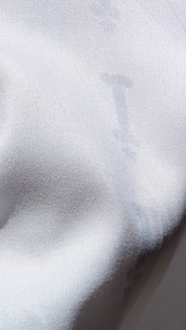 A close up of just the back layer of fabric showing the faint image that bled through.