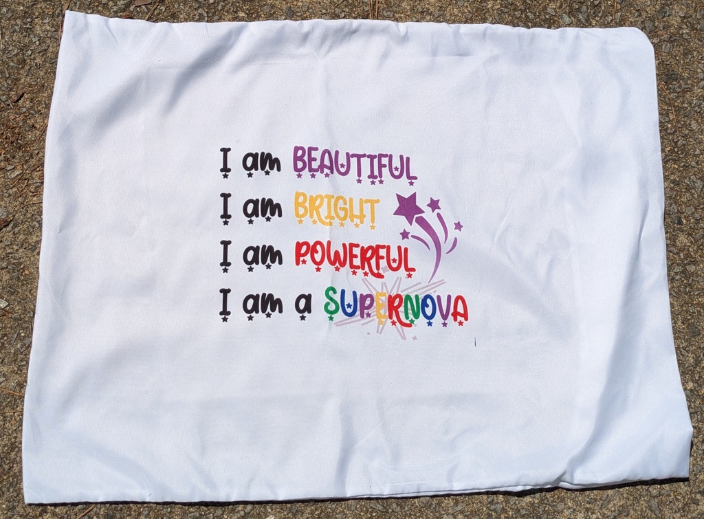 This pic of the pillowcase shows the pillowcase with a small black line at the just below and to the right of the sublimated image.